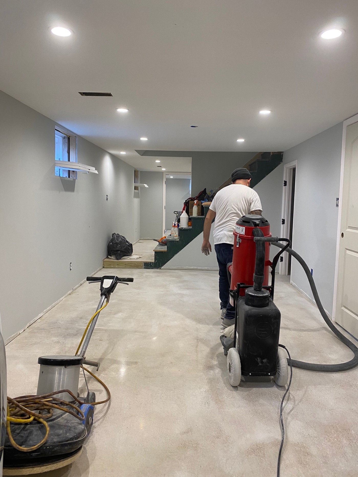 Polished Concrete & Stained Solutions crew grinding and polishing a floor on site